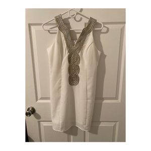 Pink lily dress size Large white in color with detailing around the neck